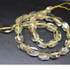 Natural Clear Quartz Smooth Tumble Beads Strand Sold per 8 inch strand and sizes from 14mm to 15mm approx.Quartz is the most common mineral found on earth. Clear quartz is a gemstone variety and also known for healing purposes. 